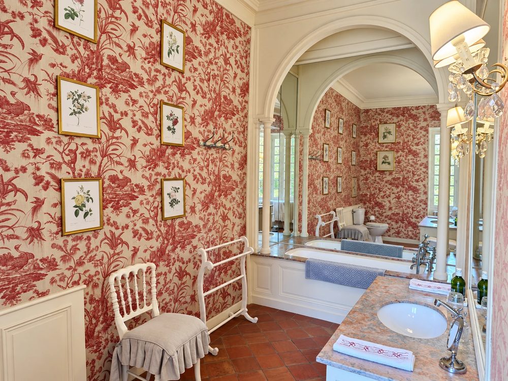 The Canopy suite bathroom, in red Toile de Jouy