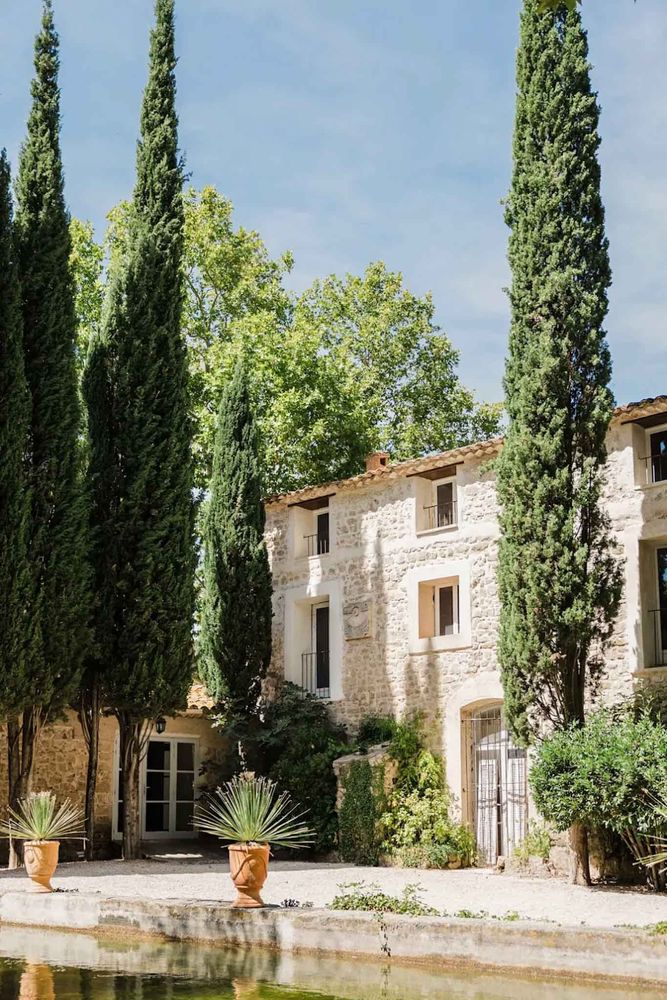 The stone house between the cypresses
