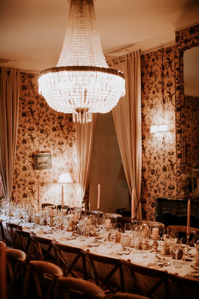 The candlelit salon and its floral fabrics