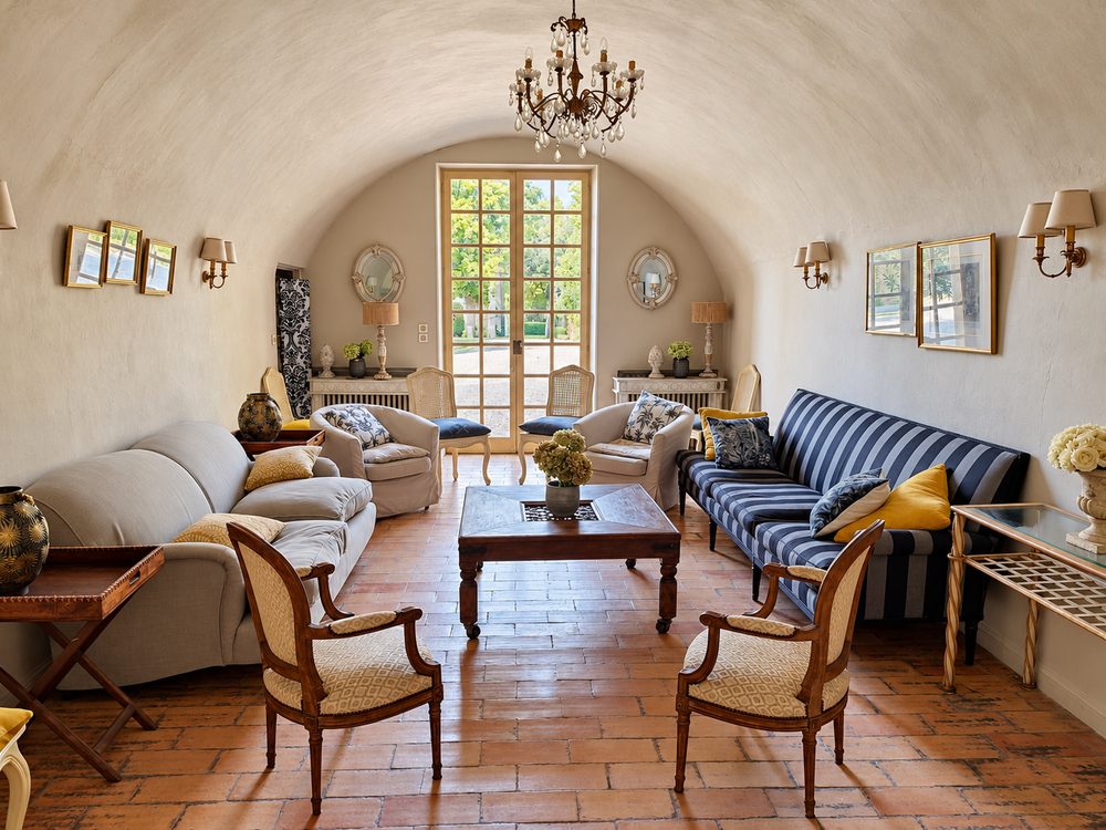 The vaulted lounge, its sofas and chandelier