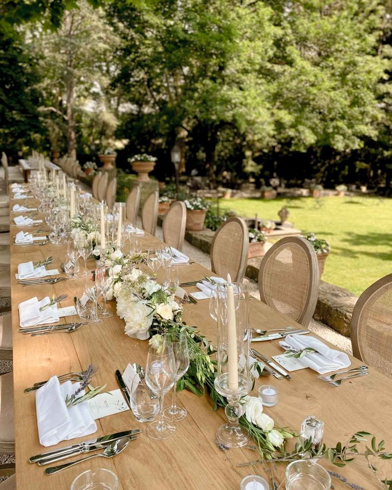 A long table laid with white flowers
