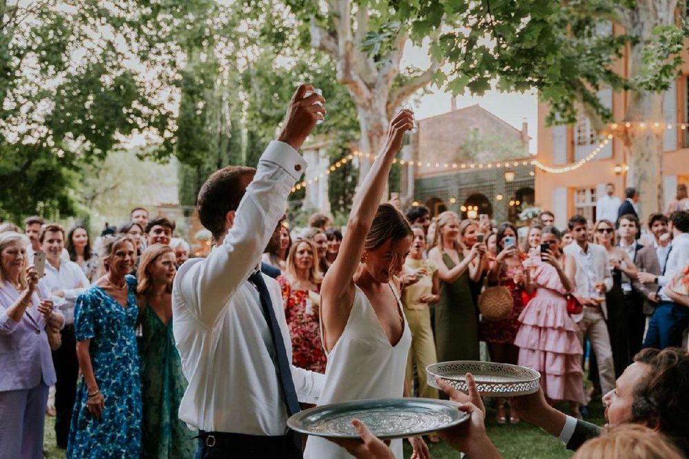 The newlyweds raise a glass at cocktail hour